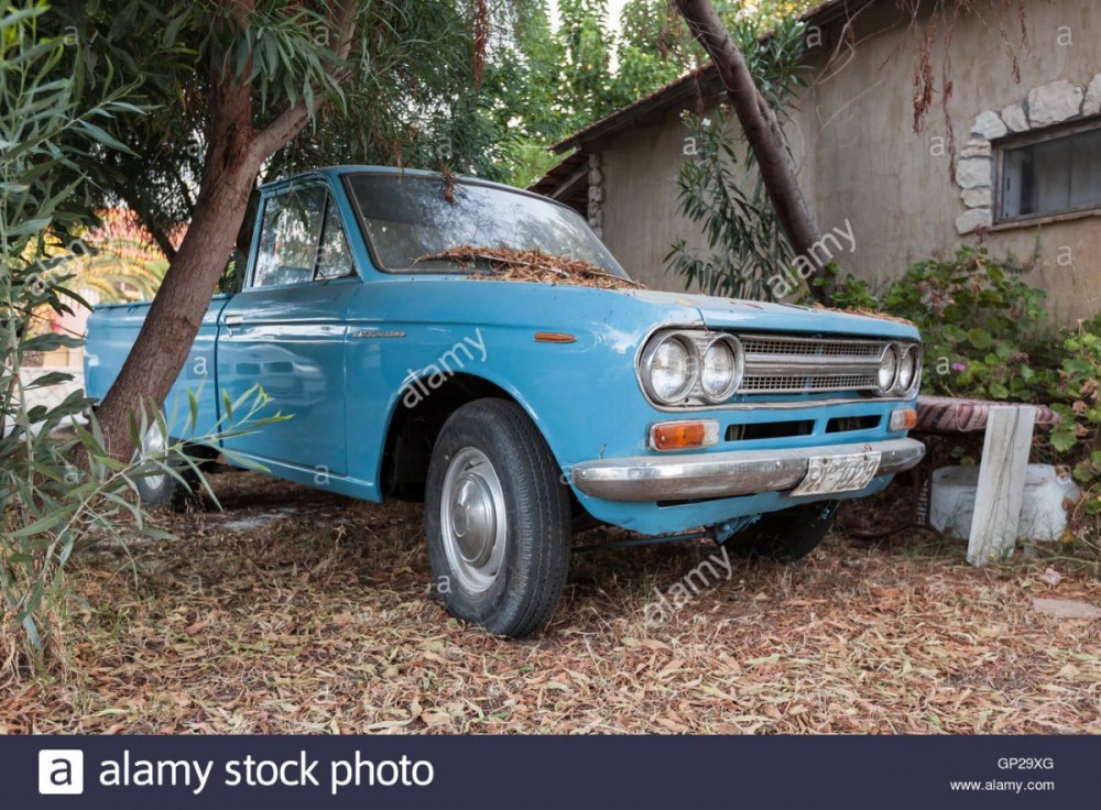 zakynthos-greece-august-16-2016-closeup-view-of-old-blue-datsun-1300-GP29XG.jpg